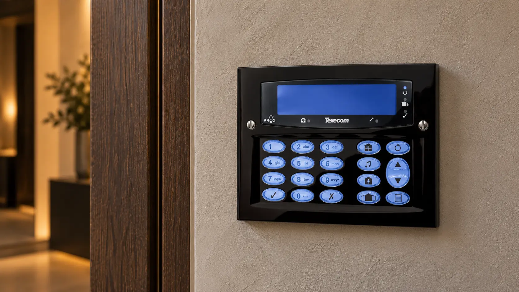 Black Texecom Premier Elite keypad installed on a finished plaster wall